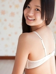 Mayumi Yamanaka smiles while undressing with erotic moves